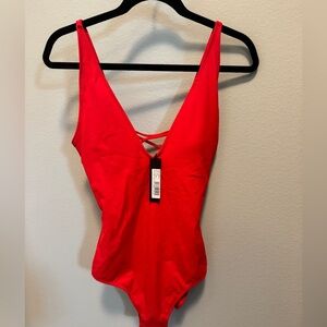 TA3 red “Plungey” swim suit in XL regular/long. Never worn. Tag attached.